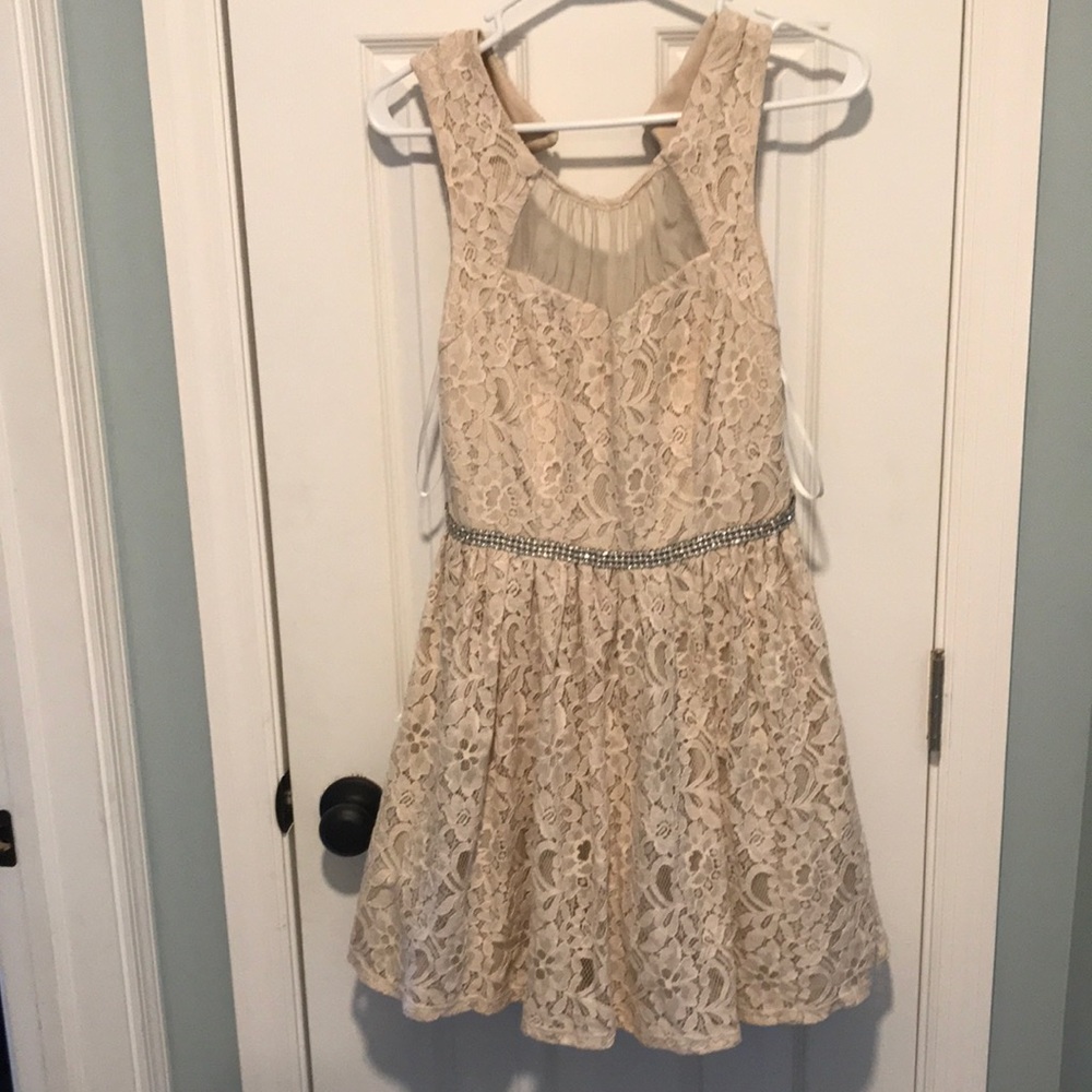 Elegant dress with studded attached belt